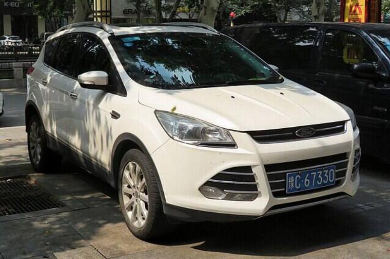 Ford Kuga parked next to a vehicle