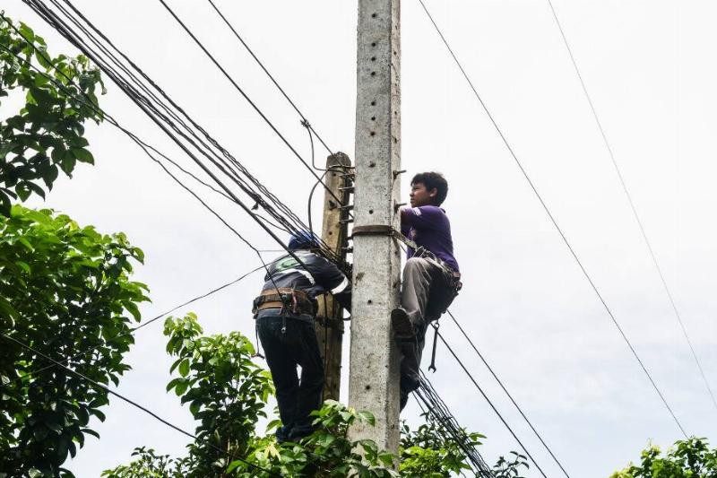 Men woking on electrical lines. 