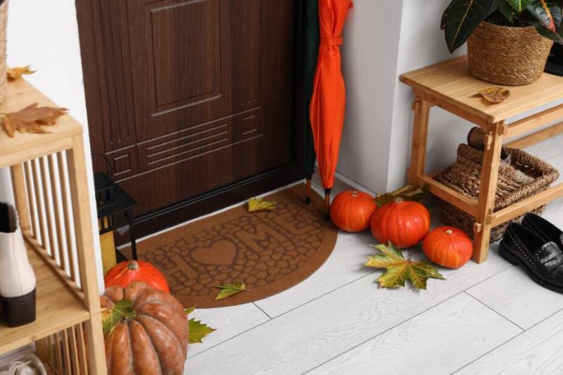 Welcome mat outside of a front door. 