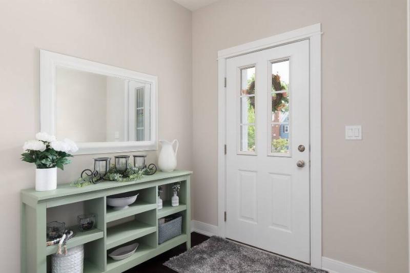 Flowers and a wreath on a door. 