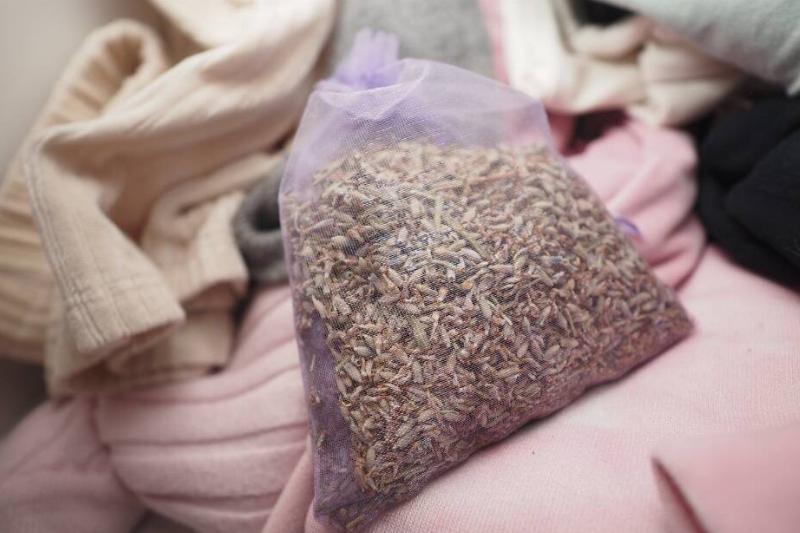 A lavender sachet tucked in a coat closet.  