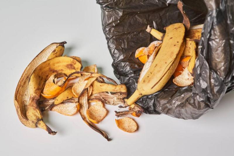 Garbage spilling out of a trash can.