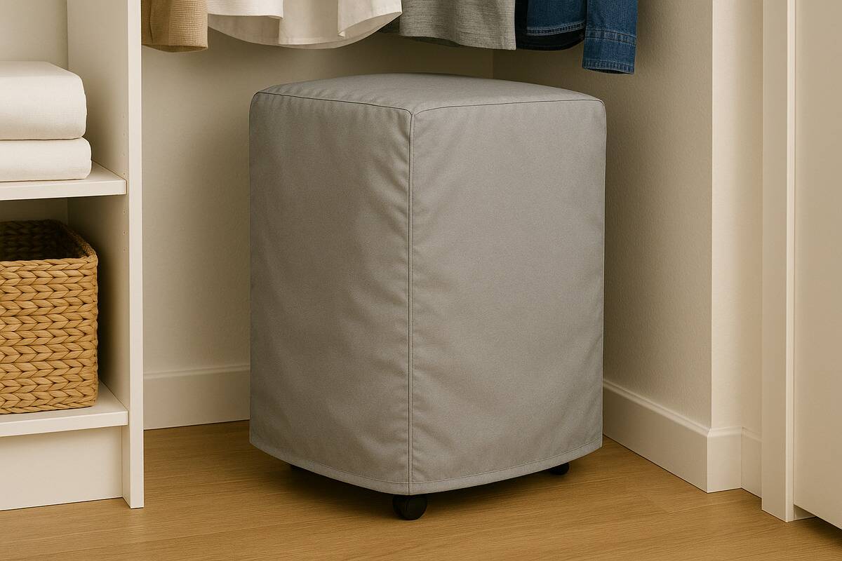 An A/C unit in storage in a closet.