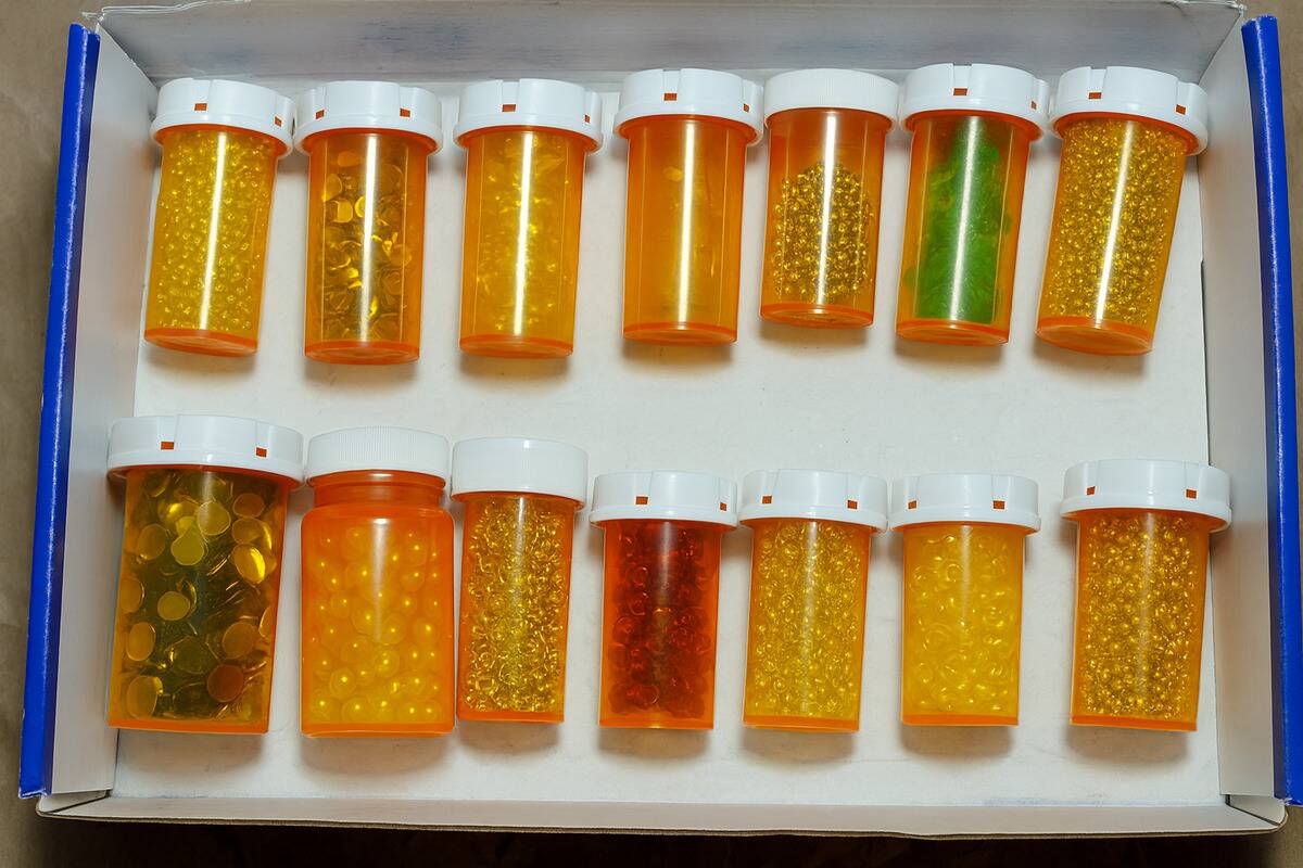 Beads stored and organized in pill bottles. 