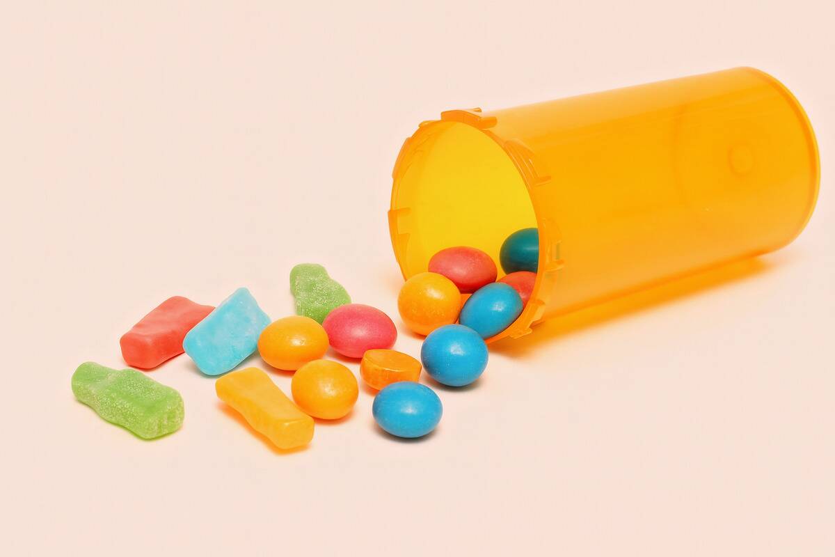 Candy spilling out of a pill bottle. 