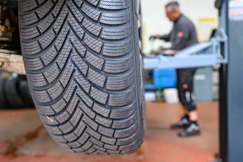 Fresh winter tires with unworn treads.