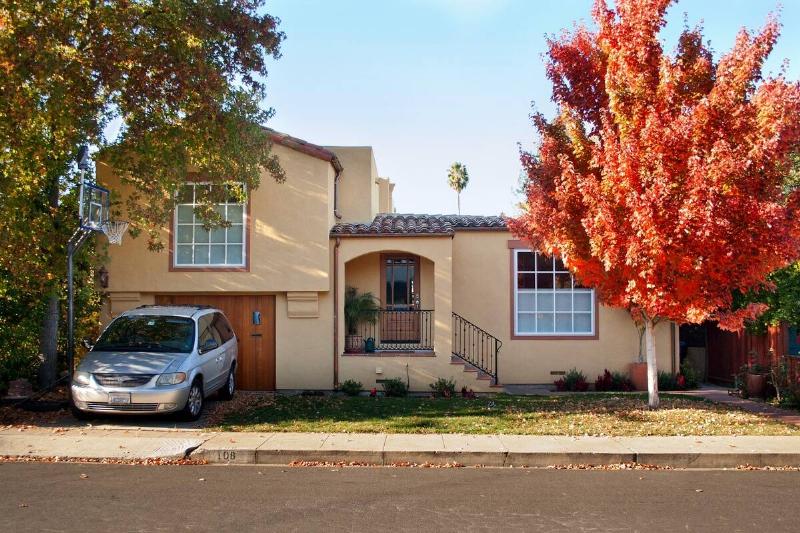 Mediterranean style Siberian American house with minivan in driveway
