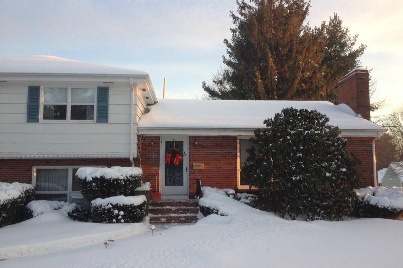 Typical American ranch house at wintertime in Maine.