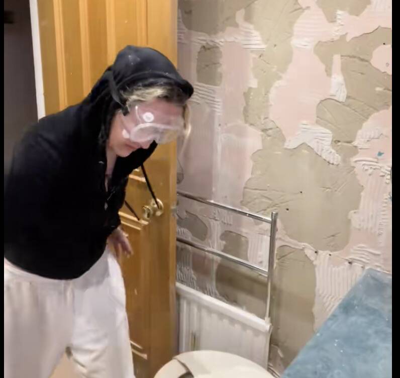 Tara renovating her bathroom. 