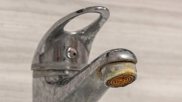 Faucet with limescale buildup. 