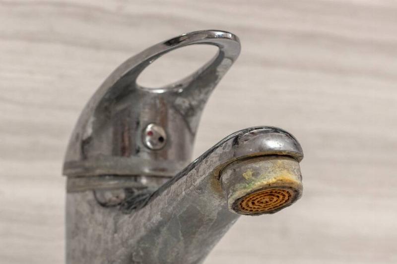 Faucet with limescale buildup. 