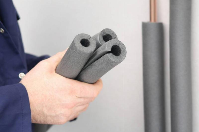 Man holding cut pool noodles.