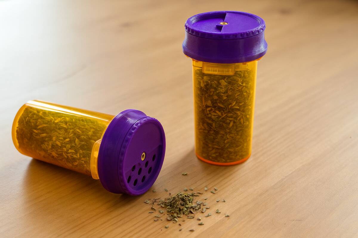 A pill bottle being used to store spices.
