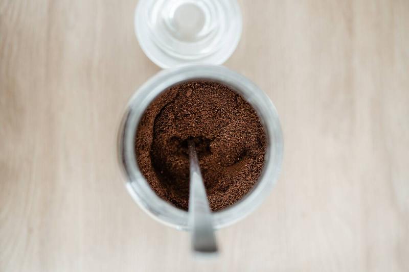 Coffee grounds in a glass container. 