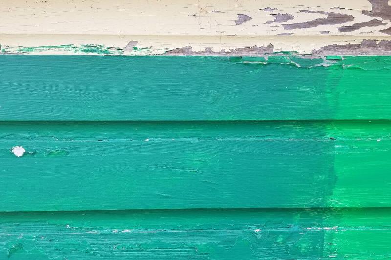 Green painted wooden board.
