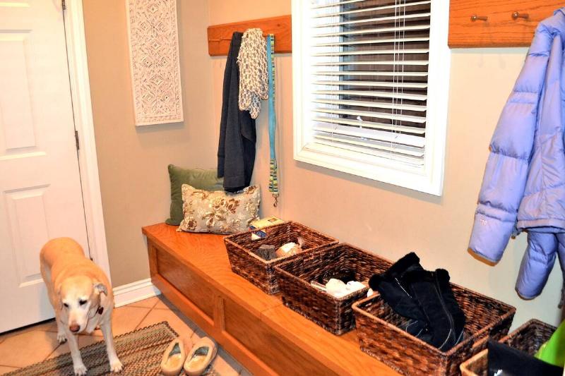 Winter gear in bins by backdoor. 