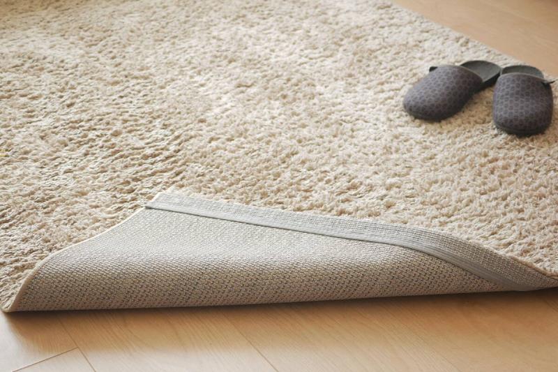 Corner of carpet flipped up. 