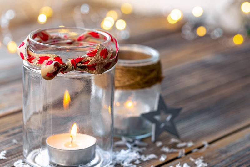 Small candles in 2 glass jars. 