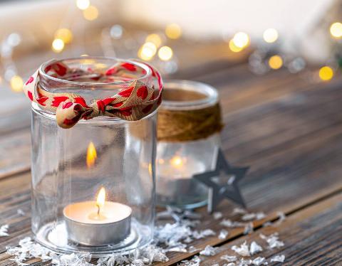 Small candles in 2 glass jars. 