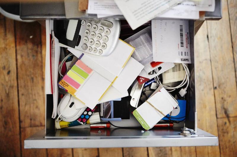Desk drawer full of stationery.