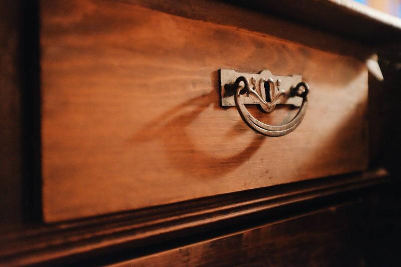 Metal hardware on wood furniture. 