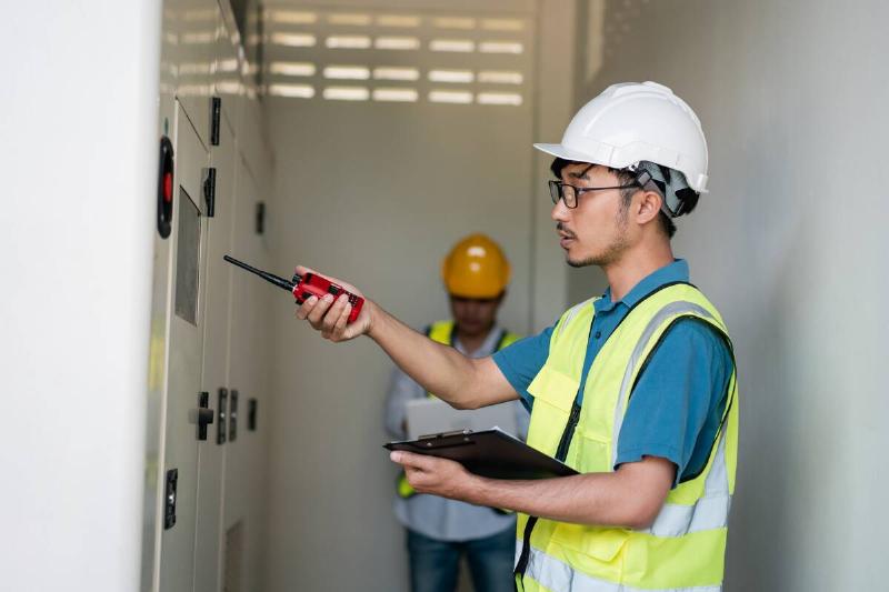 Man doing electrical inspection.