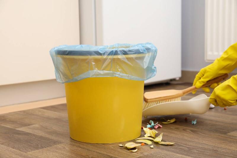 Trash bin with bag in it. 