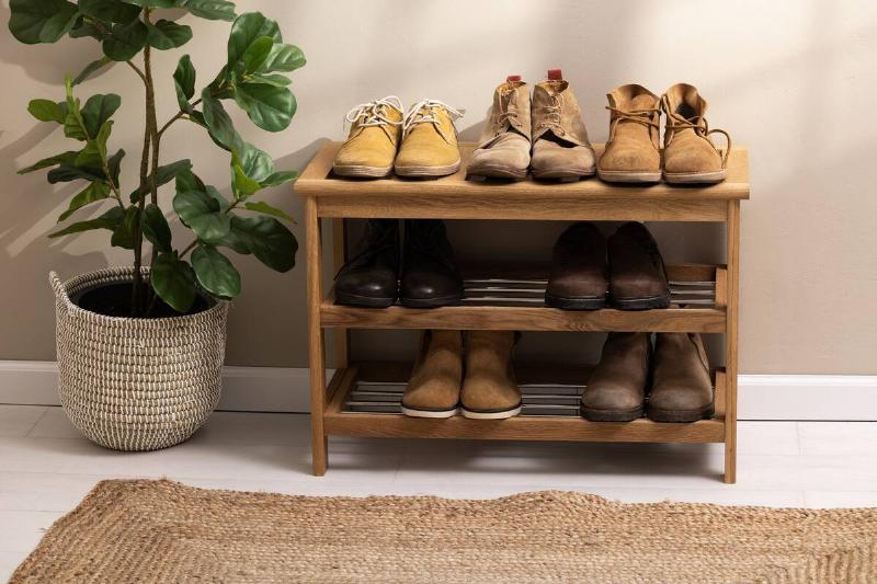 Winter boots on a shoe rack. 