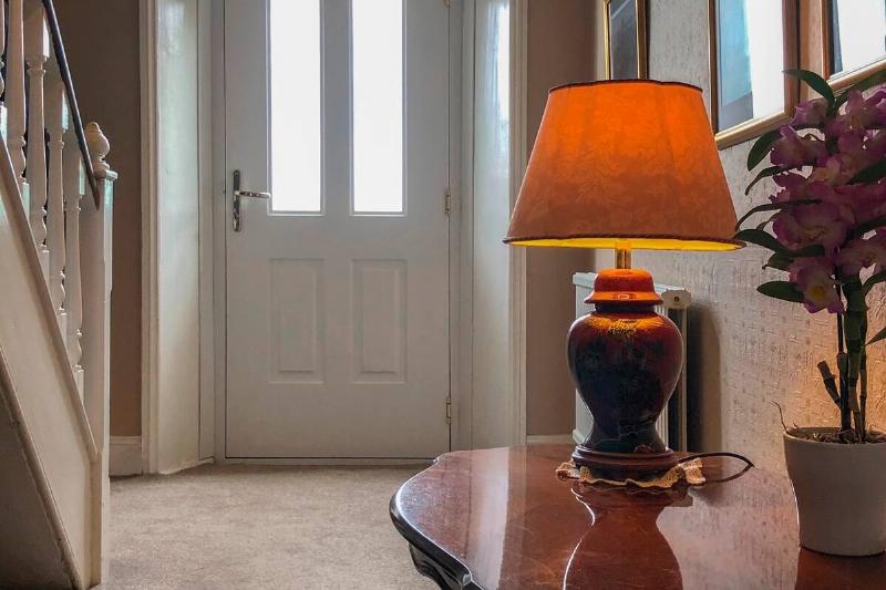 Warm lamp in entryway.