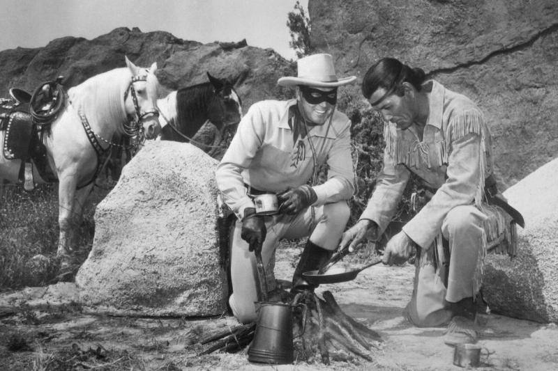 Lone Ranger and Tonto Characters Cooking Food over Camp Fire