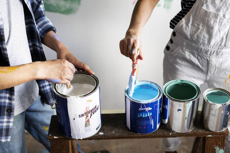 Cans of wall paint. 