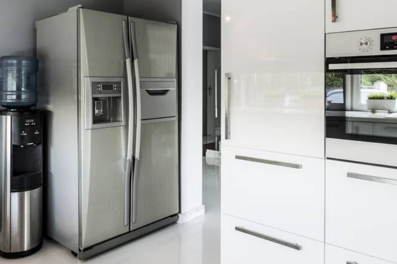 A stainless steel fridge in a kitchen.