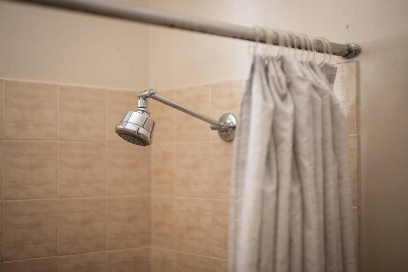 A shower curtain in a shower.