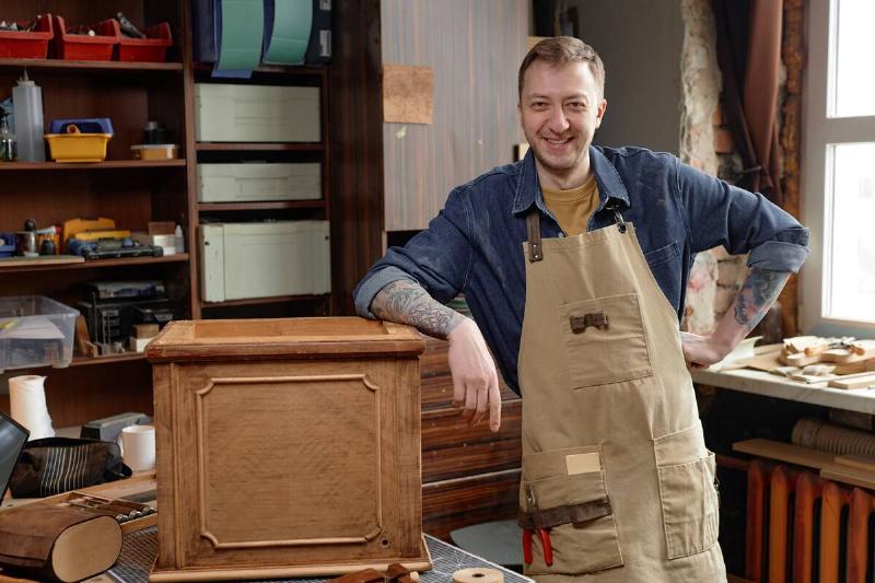 Craftsman smiling happily with his finished project.