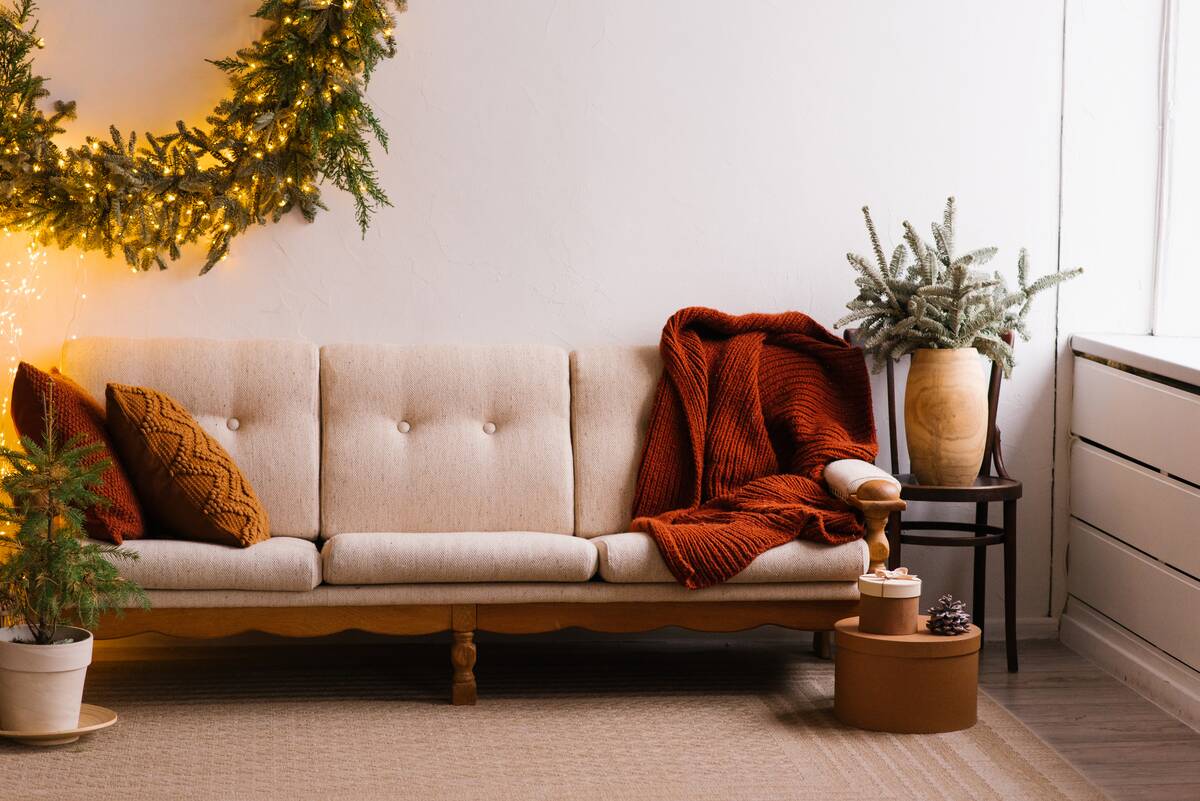 Blankets thrown over an upholstered sofa.