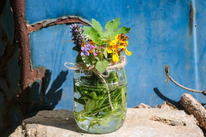 Spring flowers in a glass jar.