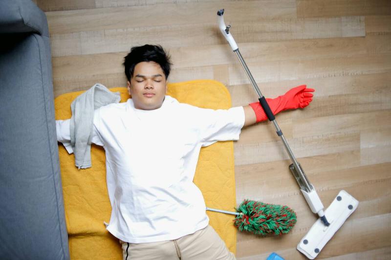 Man tired after cleaning house. 