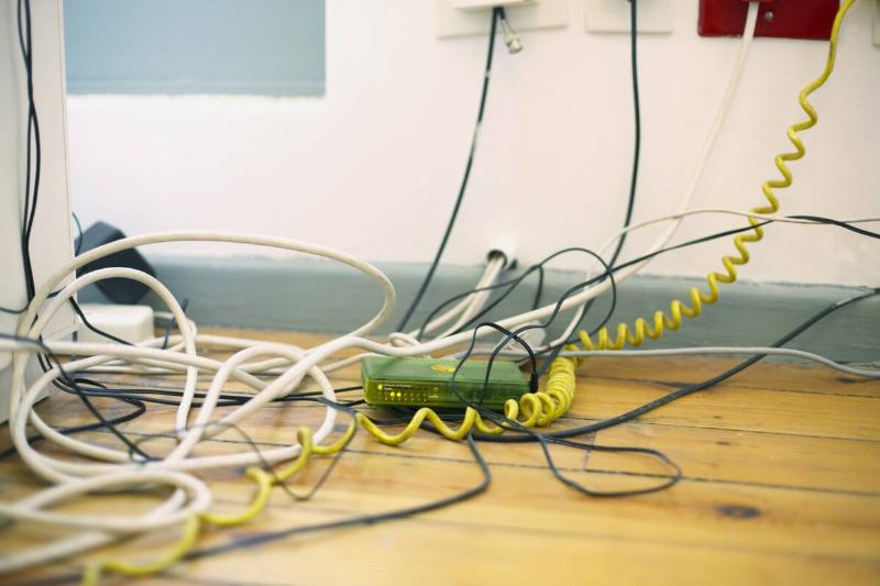 Wires tangled under desk.