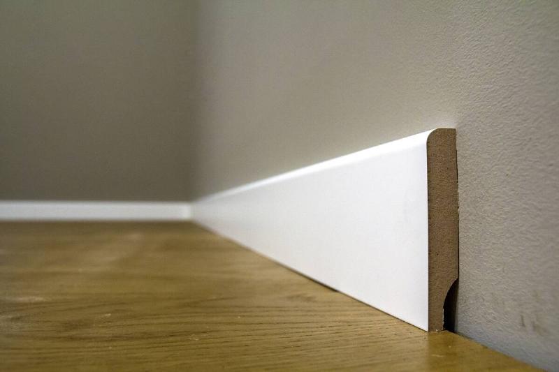 Gap between wall and baseboards.