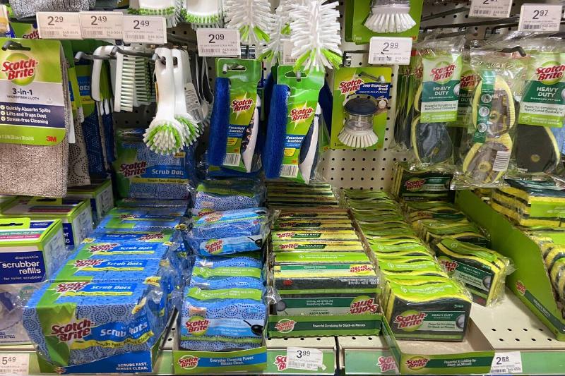 Cleaning supplies on shelves in a dollar store. 