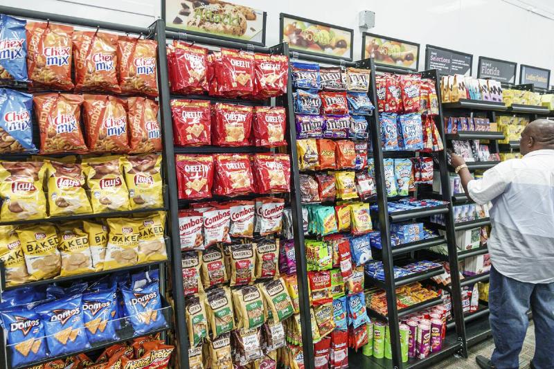 Snacks on a shelf in a store. 