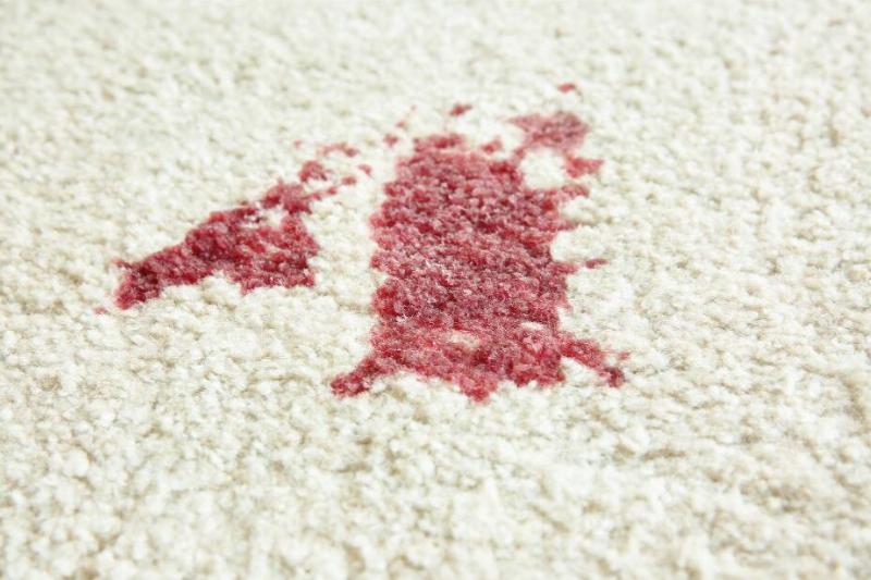 Red stain on carpet. 