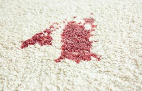 Red stain on carpet. 
