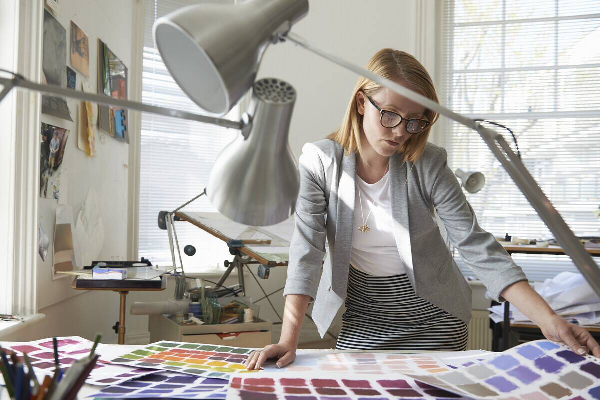 An interior designer looking at color swatches. 