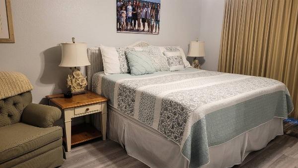 A bed made up in a guest room. 