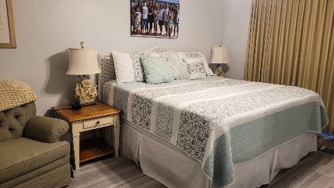 A bed made up in a guest room. 