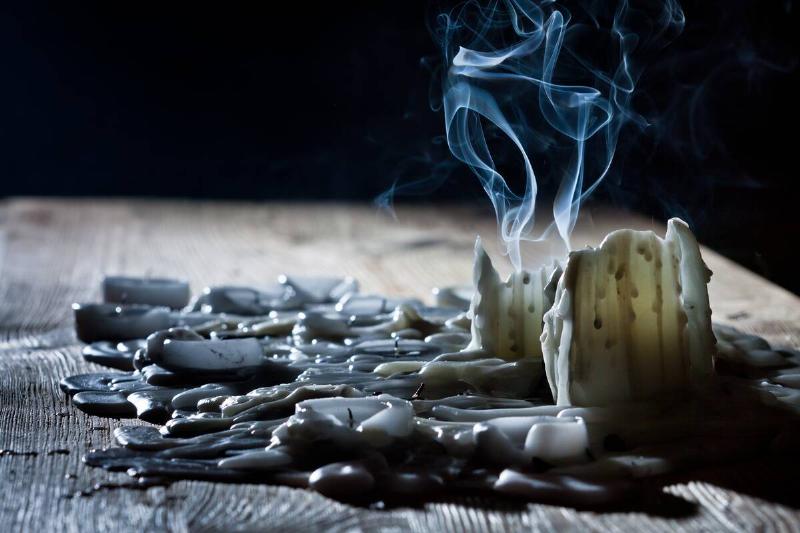 Candle wax melted on a table. 