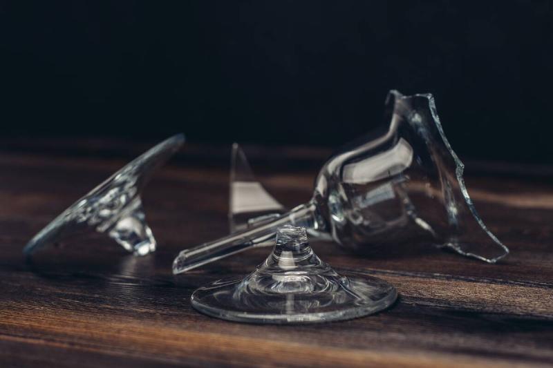 Pieces of broken glass on table.