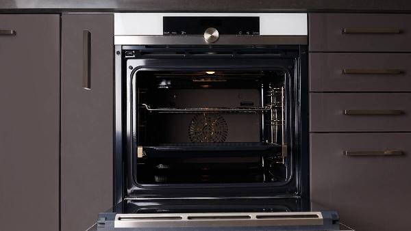 An open door of an electric oven. 