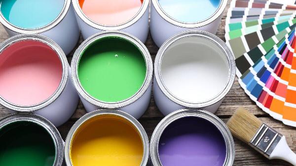 Cans of paint and paint swatches. 